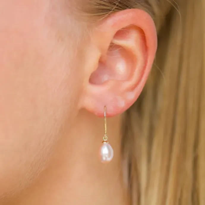 Ovale 7 - 8 mm aaa-graded ferskvandsperle øreringe i 14 karat guld med